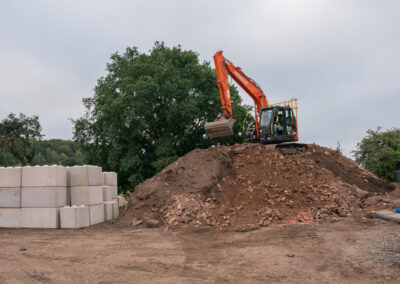 construction site with digger clearing dirt